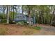 A beautiful blue home with red shutters and green trees at 2912 Pathview Ln, Marietta, GA 30062