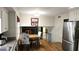Functional kitchen nook with stainless steel appliances, hardwood floors, and view to living room at 2912 Pathview Ln, Marietta, GA 30062