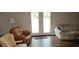 Comfortable living room features hardwood floors and doors to outdoor space at 2912 Pathview Ln, Marietta, GA 30062