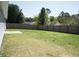 Home's large yard with a wood privacy fence around the property at 6737 Mason Creek Rd, Douglasville, GA 30135