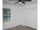 Bedroom featuring a ceiling fan, wood-look flooring, a window and a double door closet at 6737 Mason Creek Rd, Douglasville, GA 30135