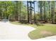 Home's long driveway and well-manicured yard at 6737 Mason Creek Rd, Douglasville, GA 30135