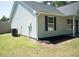 Home exterior with dark window shutters and a well-maintained lawn at 6737 Mason Creek Rd, Douglasville, GA 30135