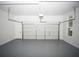 Spacious two-car garage with clean epoxy flooring and ample lighting at 6737 Mason Creek Rd, Douglasville, GA 30135