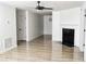 Bright living room featuring fresh paint and an accent fireplace at 6737 Mason Creek Rd, Douglasville, GA 30135