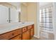 Bathroom with a vanity and drawers, a large mirror and tiled floors at 1041 Sweetwater Bridge Cir, Douglasville, GA 30134