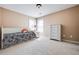Bright bedroom featuring plush carpeting, a double window, and neutral-toned walls at 1041 Sweetwater Bridge Cir, Douglasville, GA 30134