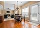 Dining area with hardwood floors is open to the living room and outdoor patio at 1041 Sweetwater Bridge Cir, Douglasville, GA 30134