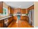 Well-equipped kitchen with stainless steel appliances and beautiful hardwood floors at 1041 Sweetwater Bridge Cir, Douglasville, GA 30134