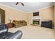 Living room features a stone fireplace, plush carpet, and comfortable seating at 1041 Sweetwater Bridge Cir, Douglasville, GA 30134