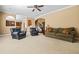 Spacious living room with carpet, fireplace, and comfortable seating arrangement at 1041 Sweetwater Bridge Cir, Douglasville, GA 30134