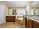 Light and bright bathroom features double sinks, a large tub, and a separate shower at 1041 Sweetwater Bridge Cir, Douglasville, GA 30134