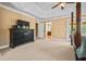 Spacious main bedroom features neutral carpet, a dark dresser, and ensuite access at 1041 Sweetwater Bridge Cir, Douglasville, GA 30134