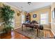 Elegant office with hardwood floors, decorative rug, and ample natural light at 1041 Sweetwater Bridge Cir, Douglasville, GA 30134