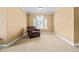Cozy sitting area with a comfortable leather chair, neutral carpet, and natural light at 1041 Sweetwater Bridge Cir, Douglasville, GA 30134