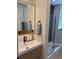 Modern bathroom with sleek fixtures, vanity, and glass-enclosed shower and bathtub at 301 10Th Ne St # 3, Atlanta, GA 30309