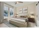 Comfortable bedroom with ample natural light, ceiling fan, and neutral decor at 301 10Th Ne St # 3, Atlanta, GA 30309
