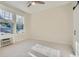 Bedroom with large windows allowing for natural light and simple decor at 301 10Th Ne St # 3, Atlanta, GA 30309