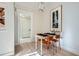 Cozy dining area features modern light fixture, table with seating, and artwork at 301 10Th Ne St # 3, Atlanta, GA 30309