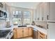 Bright kitchen features white countertops, tan cabinetry, and stainless steel appliances at 301 10Th Ne St # 3, Atlanta, GA 30309