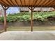 Outdoor patio with wooden ceiling offers a view of the lush green surroundings, creating a relaxing atmosphere at 3501 Chattahoochee Summit Se Ln, Atlanta, GA 30339