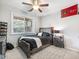 Well-lit bedroom with cozy decor, a ceiling fan, and a sporty Atlanta theme for a comfortable ambiance at 3501 Chattahoochee Summit Se Ln, Atlanta, GA 30339