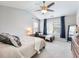 Bedroom features neutral color palette, large window, and chaise lounge at 3501 Chattahoochee Summit Se Ln, Atlanta, GA 30339
