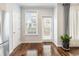Breakfast room features hardwood floors, large window and access to a patio at 3501 Chattahoochee Summit Se Ln, Atlanta, GA 30339