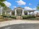 Charming clubhouse with stone accents, a covered porch, and lovely landscaping welcomes residents and guests alike at 3501 Chattahoochee Summit Se Ln, Atlanta, GA 30339