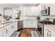 Kitchen with granite countertops, stainless steel appliances and white cabinetry at 3501 Chattahoochee Summit Se Ln, Atlanta, GA 30339