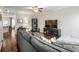Living room view into the kitchen with hardwood floors and a large TV at 3501 Chattahoochee Summit Se Ln, Atlanta, GA 30339