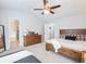 Spacious main bedroom with a vaulted ceiling, ceiling fan, wood furnishings, and en suite bathroom at 3501 Chattahoochee Summit Se Ln, Atlanta, GA 30339