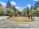 Well-maintained neighborhood entrance features manicured landscaping and signage for a welcoming first impression at 3501 Chattahoochee Summit Se Ln, Atlanta, GA 30339