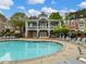 Community pool with inviting water, surrounded by ample seating and a charming pavilion in a relaxing atmosphere at 3501 Chattahoochee Summit Se Ln, Atlanta, GA 30339