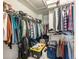 Walk-in closet with ample shelving and hanging space for organizing clothes and accessories at 3501 Chattahoochee Summit Se Ln, Atlanta, GA 30339