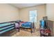 A bedroom featuring twin bunk beds and a window allowing natural light to illuminate the interior at 3541 Condor Ct, Atlanta, GA 30331