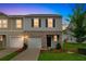 Charming two-story home with brick accents, a well-manicured lawn, and an attached garage at 3541 Condor Ct, Atlanta, GA 30331