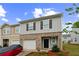 A well-kept two-story home featuring an attached garage and neatly landscaped front yard at 3541 Condor Ct, Atlanta, GA 30331