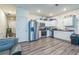 Bright kitchen featuring stainless steel appliances, white cabinetry, and wood-style flooring at 3541 Condor Ct, Atlanta, GA 30331