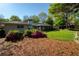 Beautiful yard featuring a home, porch, azalea bushes, and trees at 5132 Foxwood Ct, Atlanta, GA 30360
