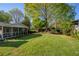 Well-maintained backyard with lush lawn and screened in porch at 5132 Foxwood Ct, Atlanta, GA 30360