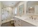 Bathroom features double sinks, modern fixtures, and a tiled walk-in shower with a glass door at 5132 Foxwood Ct, Atlanta, GA 30360