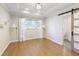 Bright bedroom with hardwood floors, light sconces, and access to a private bathroom at 5132 Foxwood Ct, Atlanta, GA 30360