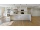 Modern kitchen with white cabinetry, stainless steel appliances, a large island, and stylish pendant lighting at 5132 Foxwood Ct, Atlanta, GA 30360