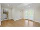 Open-concept living room with access to the laundry room and to the outdoor patio through french doors at 5132 Foxwood Ct, Atlanta, GA 30360