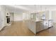 Spacious living room offers open layout, marble kitchen island, fireplace, and access to outdoors at 5132 Foxwood Ct, Atlanta, GA 30360