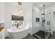 Elegant bathroom with freestanding tub, modern fixtures, and frameless glass shower at 878 Dill Sw Ave, Atlanta, GA 30310