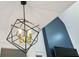 Stylish black and gold geometric chandelier adds a modern touch to the room's decor at 878 Dill Sw Ave, Atlanta, GA 30310