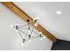 Modern chandelier with geometric design and exposed bulbs adds style to the room at 878 Dill Sw Ave, Atlanta, GA 30310