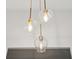 Contemporary light fixture with glass shades illuminates the room at 878 Dill Sw Ave, Atlanta, GA 30310